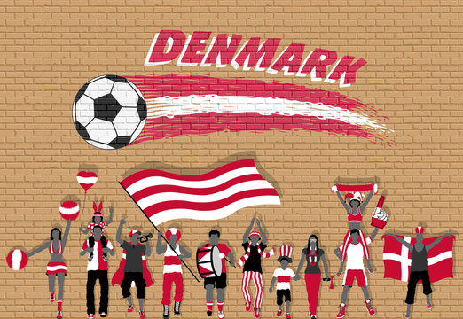 Danish football fans cheering with Denmark flag colors in front of soccer ball graffiti