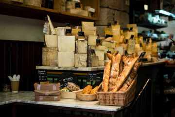 Store front selling breads, hard cheeses, baguette and traditional scottish food.