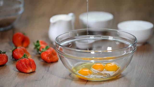 Beaten Eggs with Mixer Whisks in Bowl.