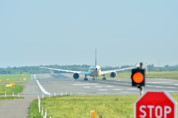 Airplane goes to the position for takeoff at an airport runway