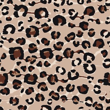Seamless vector repeat animal leopard spots texture in black, brown, cream with a tan background.