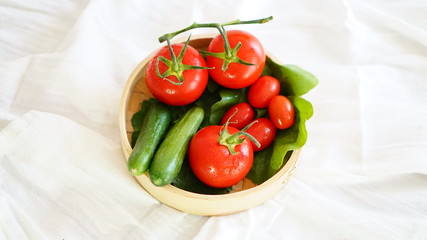 fresh organic vegetable. Tomatoes, cherry tomatoes, cucumber with white background