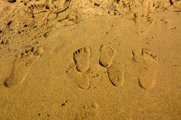 Fototapeta na wymiar Footprints in the Glifada beach, Greece.