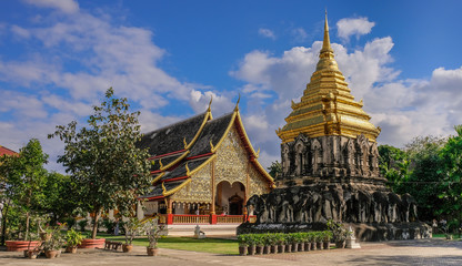Fototapeta premium Chiang Mai, Thailand - December 30, 2017: Golden dome pagoda in a Buddhist temple of Chiang Mai