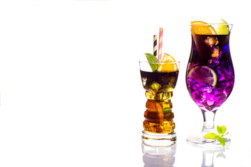 Selection of colorful festive drinks, alcoholic beverages and cocktails in elegant glasses on white