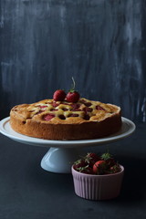 Strawberry cake on a black background