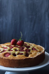 Strawberry cake on a black background