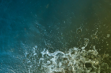 Fototapeta na wymiar beautiful splashes of waves, splashes of foam in the water