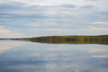 beautiful, picturesque nature. The lake is surrounded by forest.