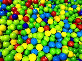 Fototapeta na wymiar A pile of colorful sphere plastic balls - kids ball pit