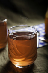 Cups of tea on the grunge background. Hot Tea in glass cup