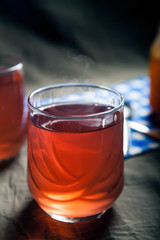 Cups of tea on the grunge background. Hot Tea in glass cup