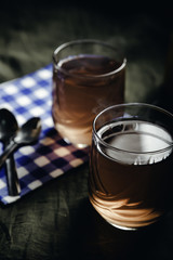 Cups of tea on the grunge background. Hot Tea in glass cup