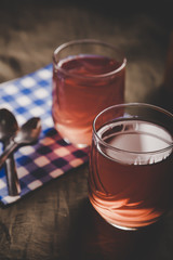 Cups of tea on the grunge background. Hot Tea in glass cup