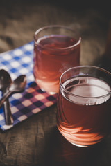 Cups of tea on the grunge background. Hot Tea in glass cup