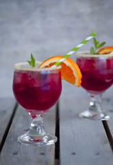 Red alcohol cocktail with berries 