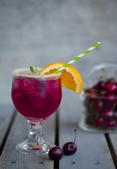 Red alcohol cocktail with berries 