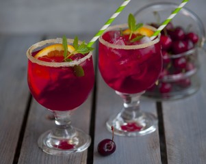 Red alcohol cocktail with berries 