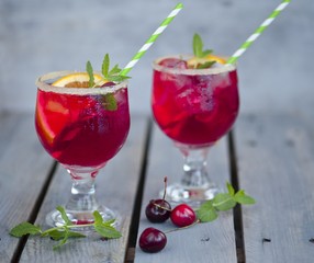 Red alcohol cocktail with berries 