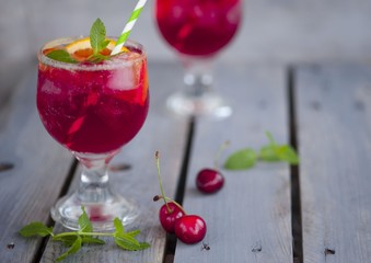 Red alcohol cocktail with berries 