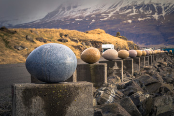Djupivogur - May 06, 2018: Egg statues in the harbor of Djupivogur, Iceland