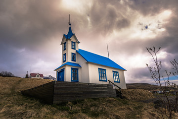 Fototapeta premium Icelandic countryside - May 06, 2018: Church in a small town in Iceland
