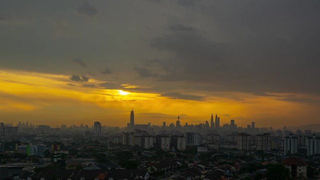 4K Time lapse of majestic sundown over downtown Kuala Lumpur, capital city of Malaysia. Zoom In.	