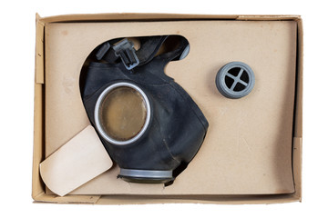 Vintage German Kinder, or child's, gas mask from late World War II, Volkssturm, in a box, isolated on white