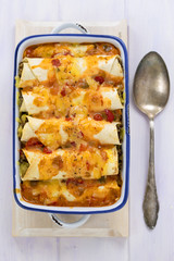 Beef enchiladas with tomato sauce and cheese 