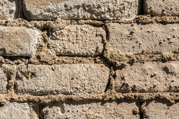 texture of the old wall of brick blocks, scattered brick and brickwork, architecture abstract background