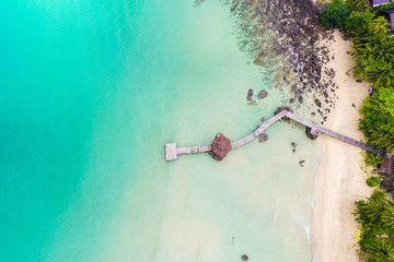 Obraz na płótnie Canvas Tropical white sand bech with coconut palm tree background idyllic turquoise sea