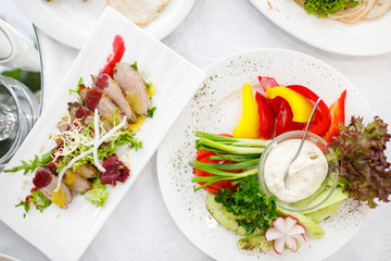catering table set service with silverware and glass stemware at