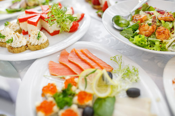 catering table set service with silverware and glass stemware at