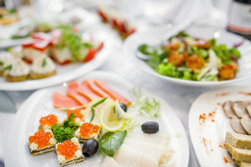delicious dishes on the table in the restaurant. serving table.