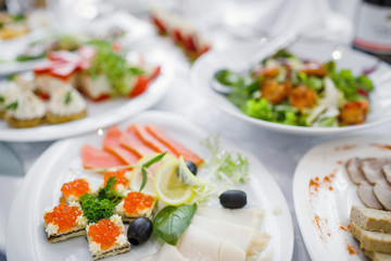 catering table set service with silverware and glass stemware at