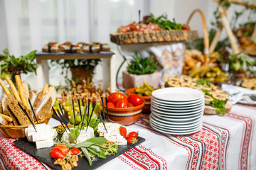 Beautifully decorated catering banquet table with different food