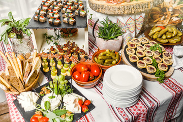 table with different type of snacks preparing for party.