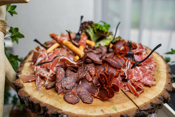 table with different type of snacks preparing for party.