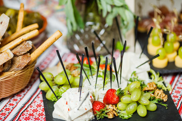 table with different type of snacks preparing for party.