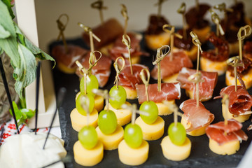 table with different type of snacks preparing for party.