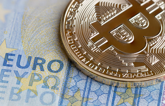 Bitcoin Cryptocurrency is Digital payment money Concept, Gold coins with B letter symbol,electronic circuit on EURO EYP20 bill.Cryptocurrency can uses designed work as medium of exchange in network