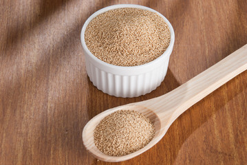 Raw Organic Amaranth grain on wooden table