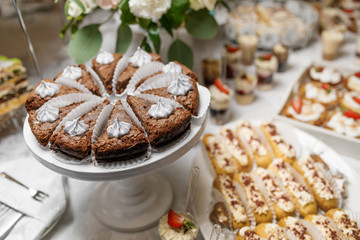 Candy Bar. Delicious sweet buffet with cupcakes. Sweet holiday b