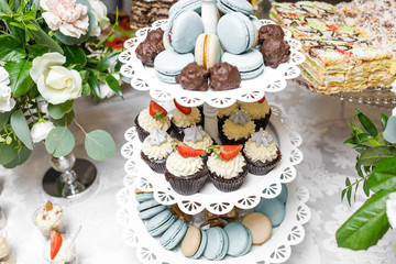 Candy Bar. Delicious sweet buffet with cupcakes. Sweet holiday b