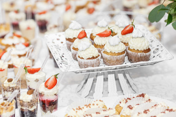 Candy Bar. Delicious sweet buffet with cupcakes. Sweet holiday b