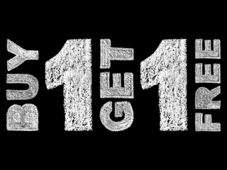 handwritten white bold chalk lettering buy 1 get 1 free text on black background, hand-drawn chalk phrase, back to school concept, stock photo image