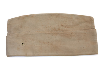 Vintage khaki World War II US Army garrison cap isolated on white