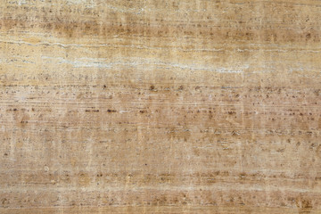 Dolomite stone surface background, a yellowish beige natural stone