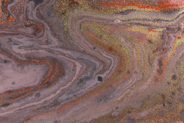 Marble abstract acrylic background. Red and purple marbling artwork texture. Agate ripple pattern. Gold powder.