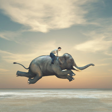 Surreal image of a man riding an elephant